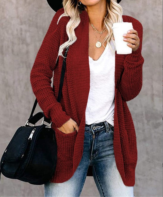 Women's knitted cardigan with practical pockets and airy structure NOVAE
