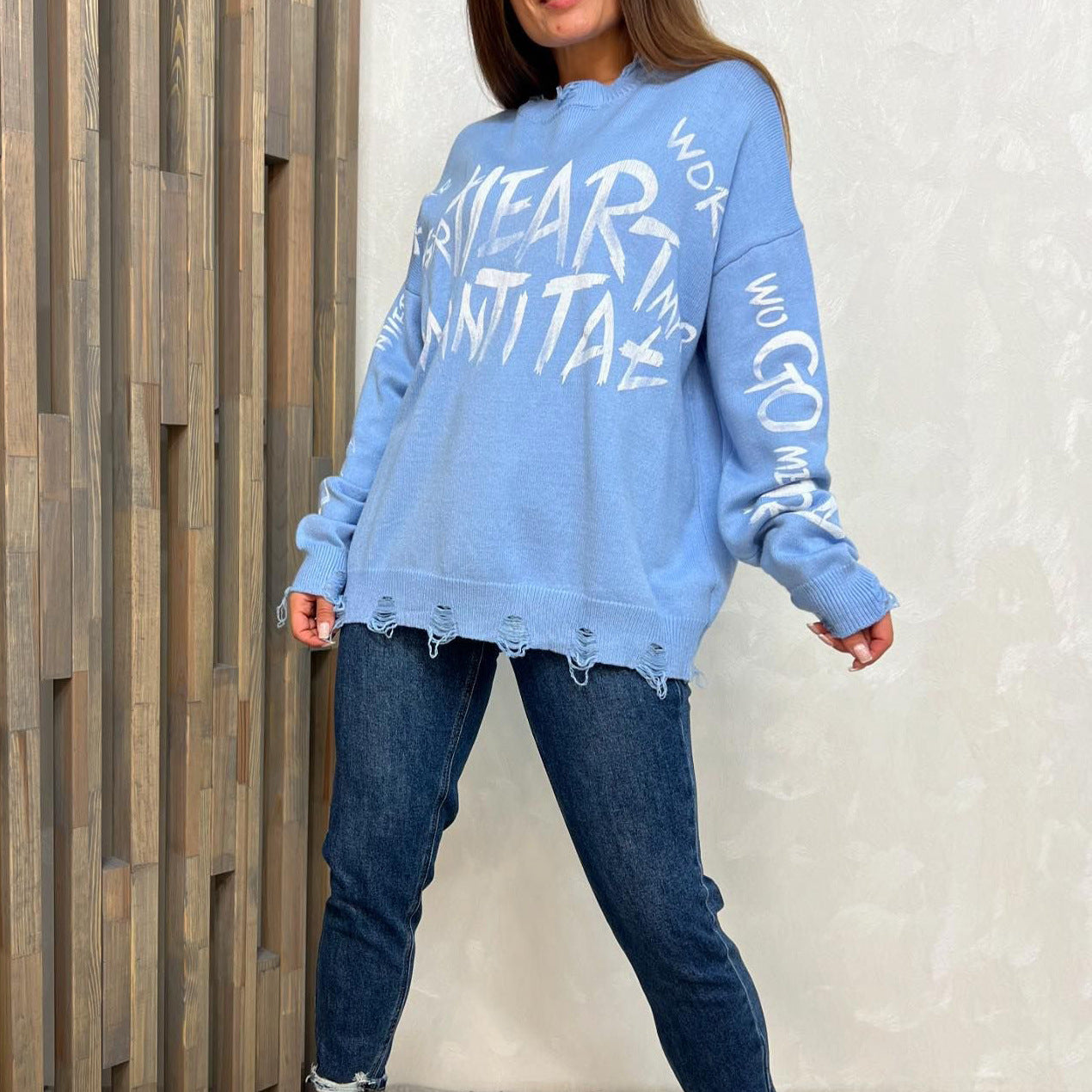 Women's oversized sweatshirt with creative lettering and fashionable ripped details NOVAE