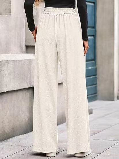 Women's wide-leg trousers with a high waistband and practical side pockets NOVAE