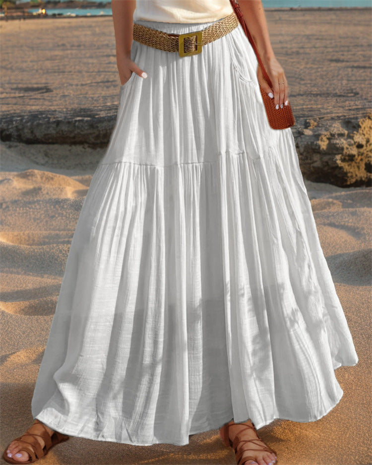 Women's wide-flared maxi skirt with elegant pleats and practical pockets NOVAE