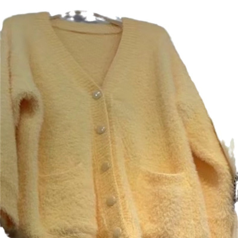 Women's oversized cardigan with soft fleece and special button details NOVAE