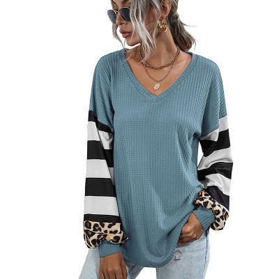 Women's sporty V-neck top with striking sleeves and unique details NOVAE