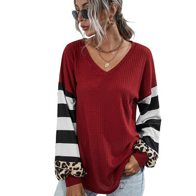 Women's sporty V-neck top with striking sleeves and unique details NOVAE
