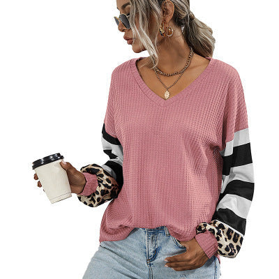 Women's sporty V-neck top with striking sleeves and unique details NOVAE