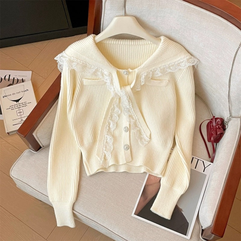 Women's cardigan with ruffled neckband and decorative buttons NOVAE