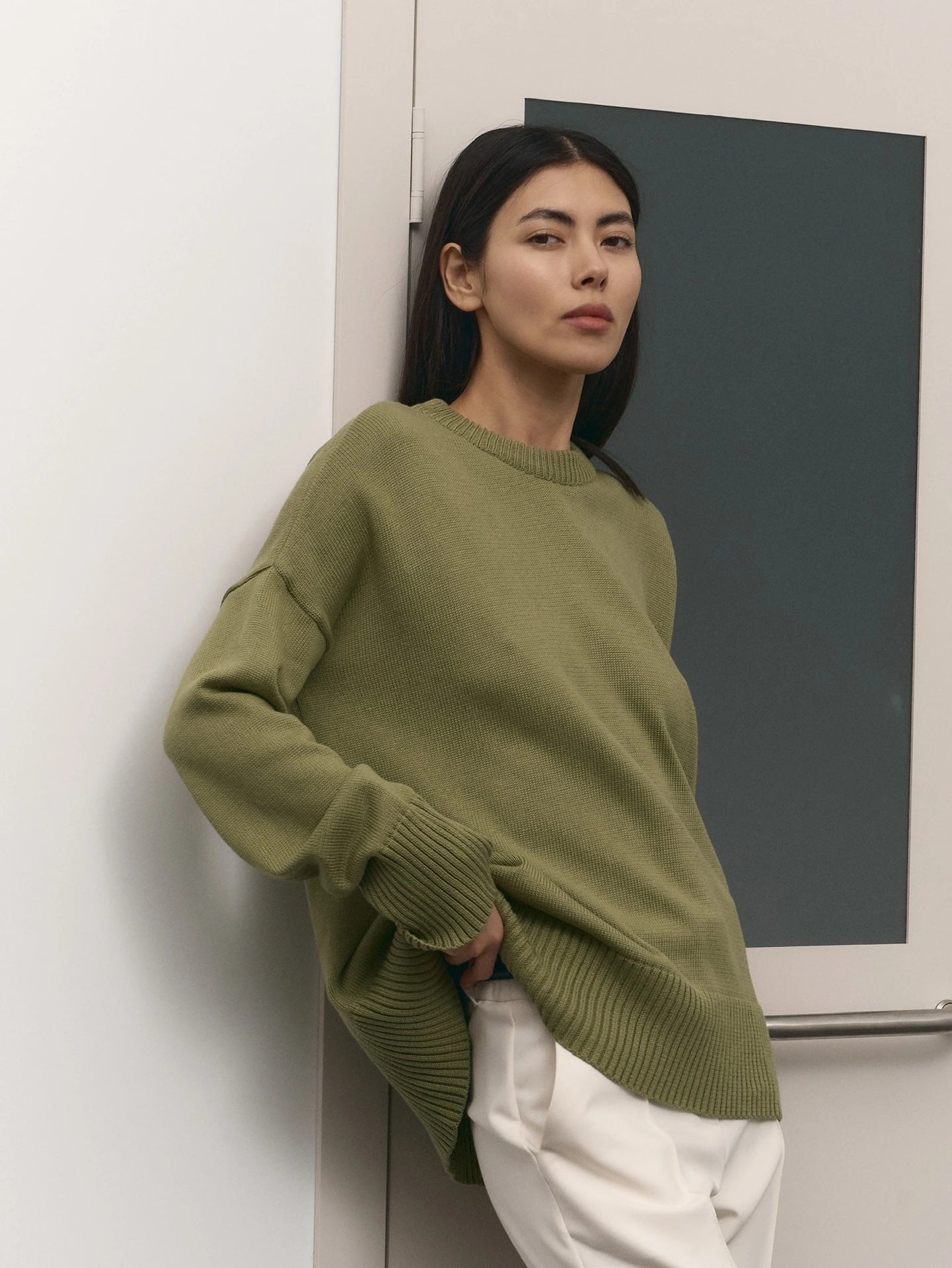 Women's casual knit sweater with an innovative cut and wide sleeves NOVAE