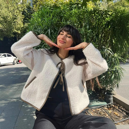 Women's fluffy short jacket with decorative tie belt NOVAE