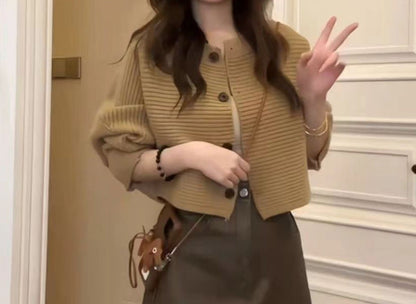 Women's fashionable knitted throw with button detail and structured design NOVAE