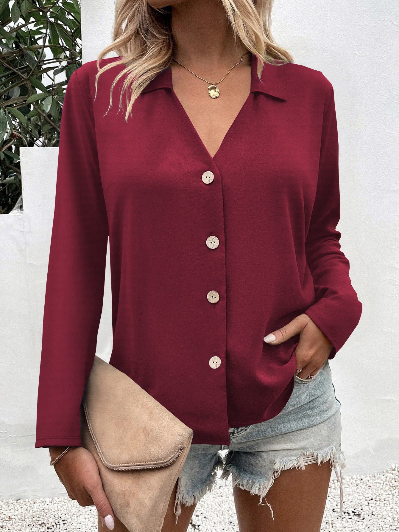 Women's fashionable blouse with V-neck and button details NOVAE
