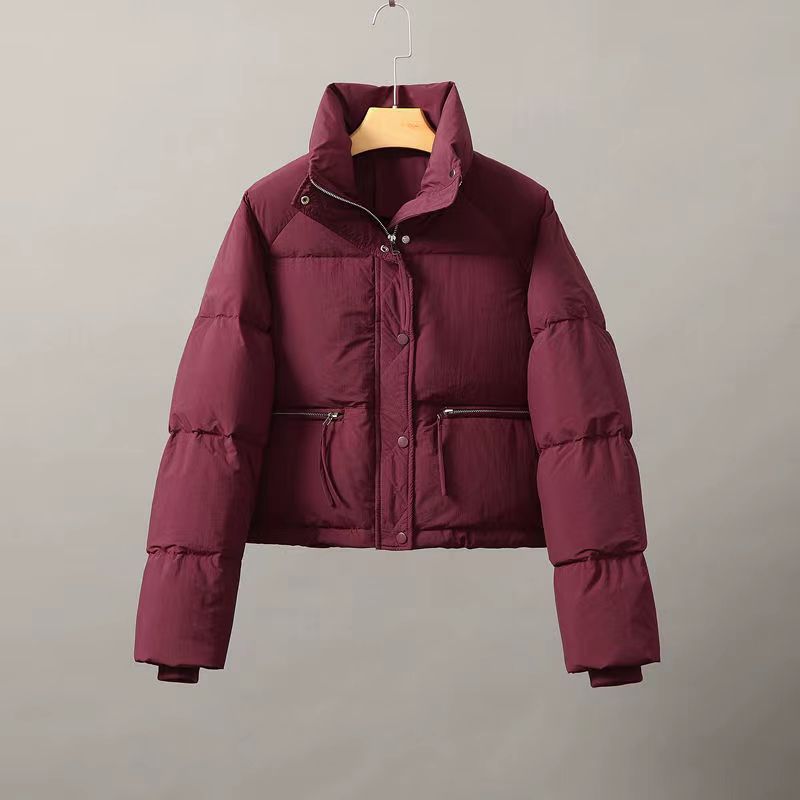 Women's quilted winter jacket with high collar and practical pockets NOVAE
