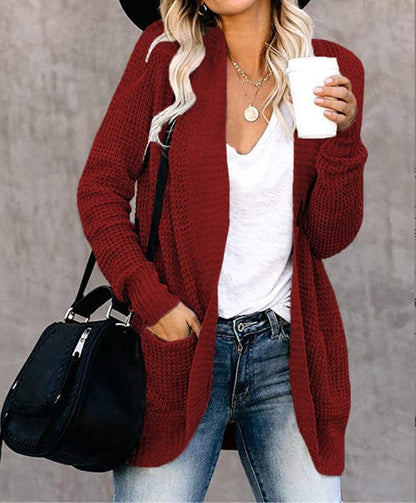 Women's knitted cardigan with practical pockets and airy structure NOVAE