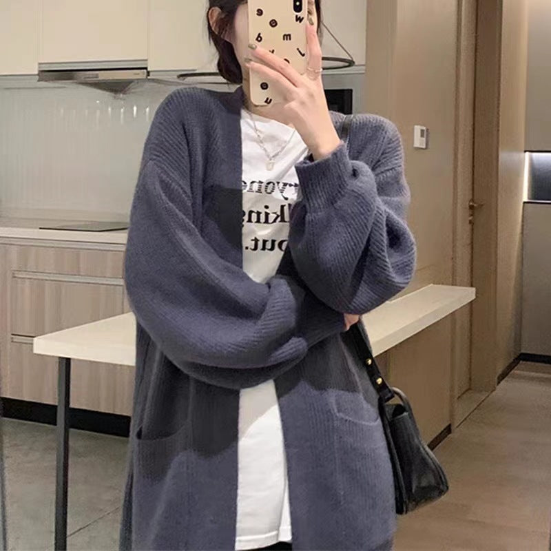 Women's long knit cardigan with practical pockets and elegant silhouette NOVAE