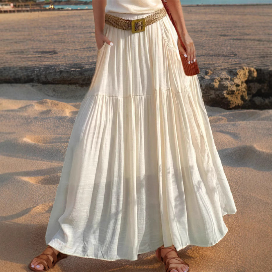 Women's wide-flared maxi skirt with elegant pleats and practical pockets NOVAE