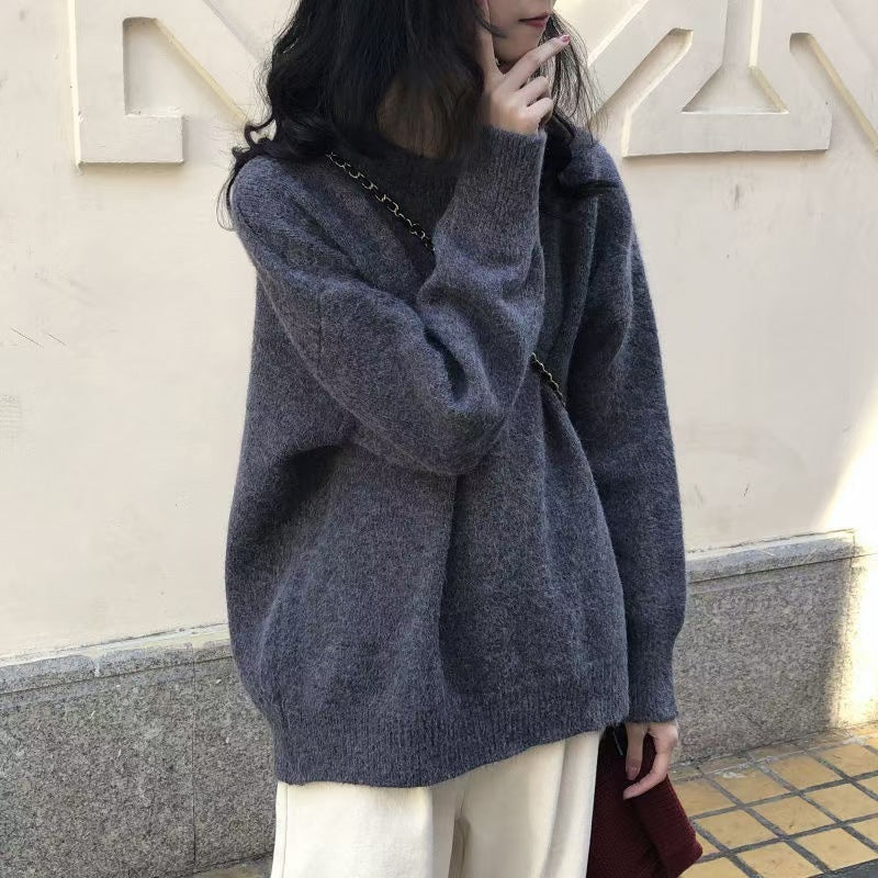 Women's oversized knit sweater with a wide cut and high cuffs NOVAE