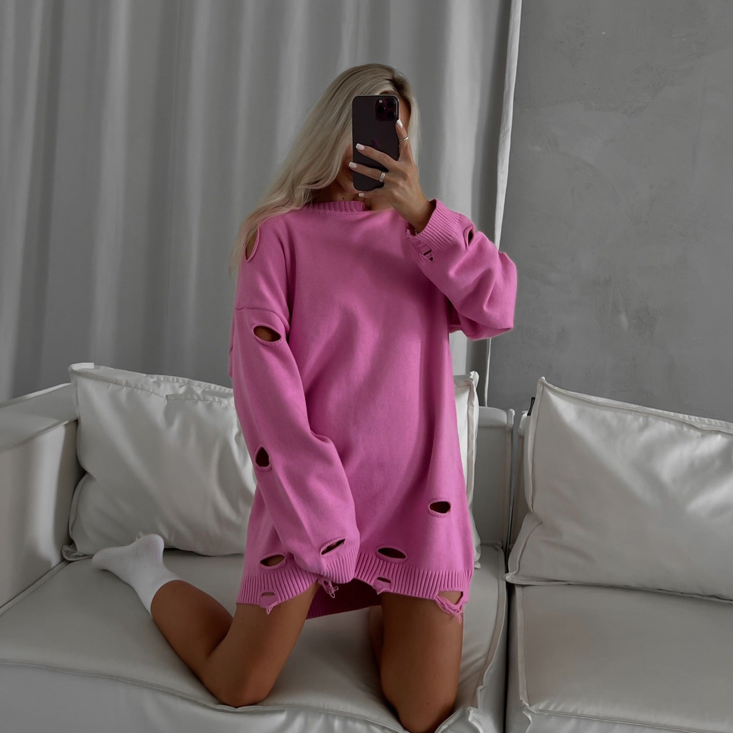 Women's oversized sweatshirt with stylish ripped details and a wide fit NOVAE