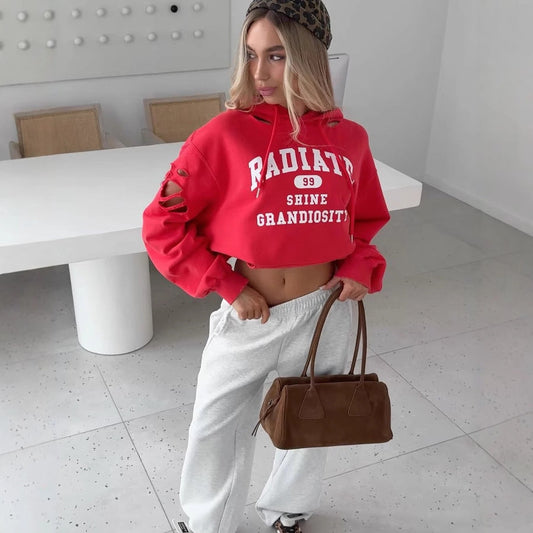 Women's cropped hoodie with creative cut details and large NOVAE lettering