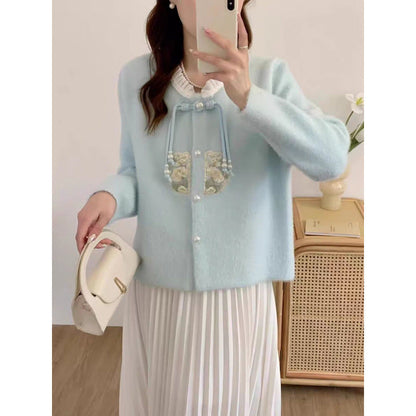 Women's luxury knit sweater with decorative button details and ruffles NOVAE