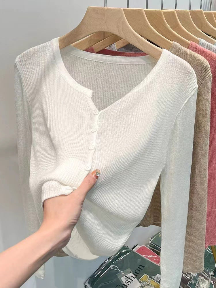 Women's figure-hugging cardigan with elegant button closure and fine ribbed texture NOVAE