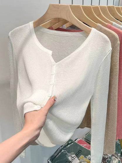 Women's figure-hugging cardigan with elegant button closure and fine ribbed texture NOVAE