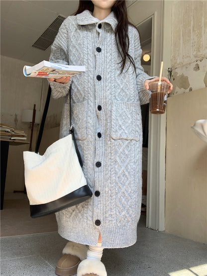 Women's chunky knit button-up coat with elegant cable pattern and practical pockets NOVAE