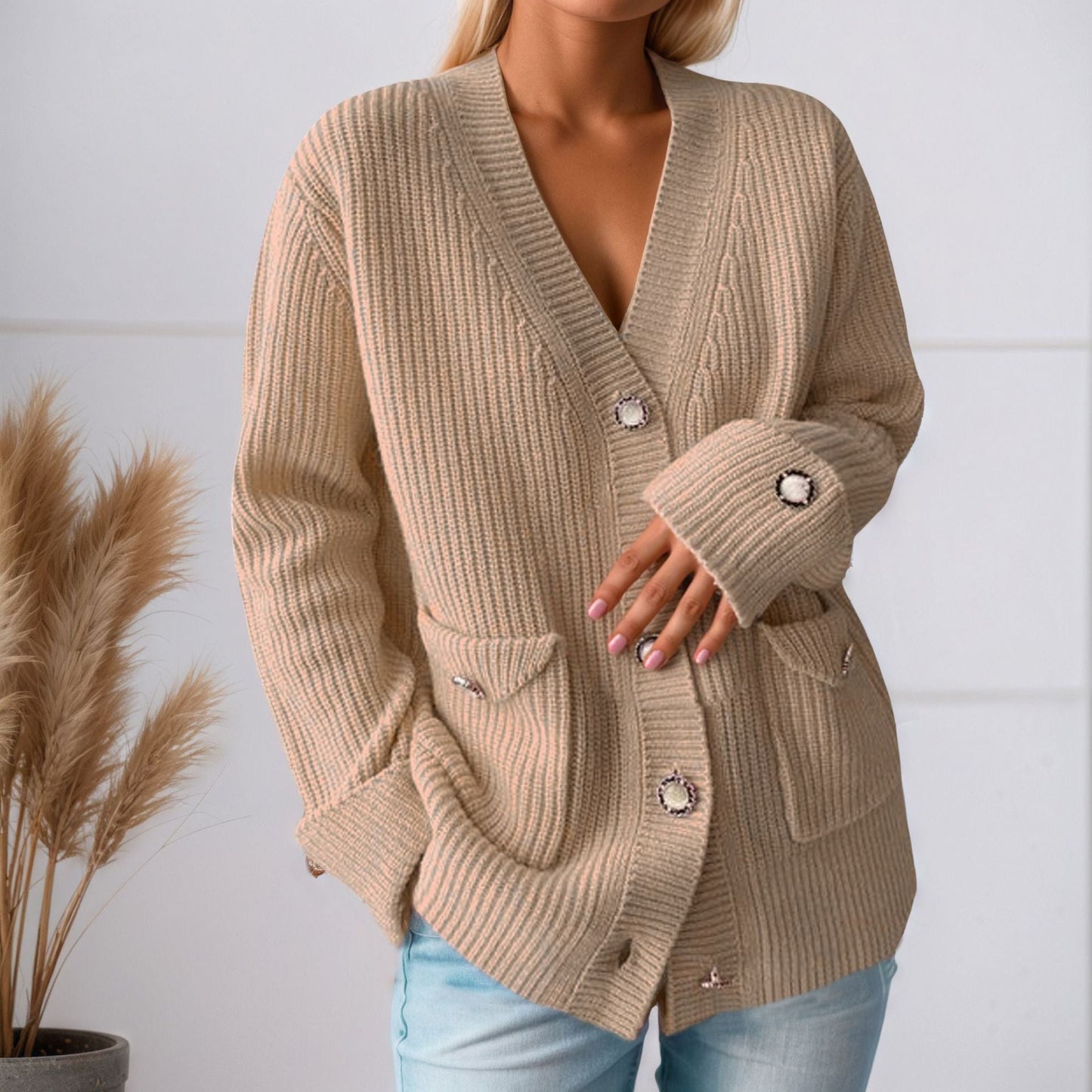 Women's chunky knit cardigan with practical pockets and elegant button details NOVAE