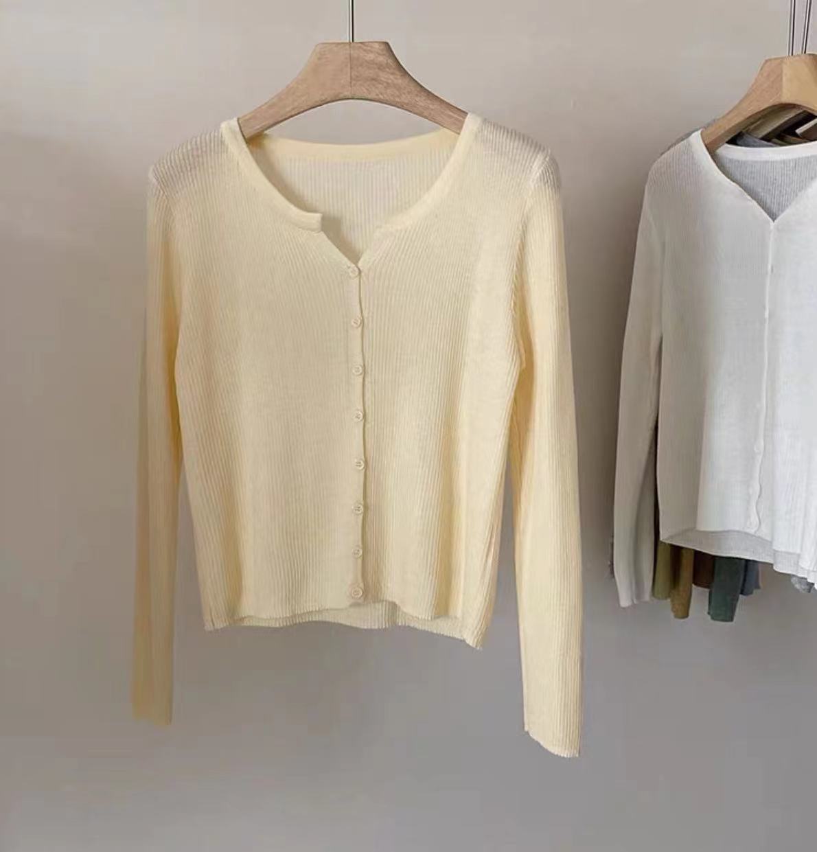 Women's figure-hugging cardigan with elegant button closure and fine ribbed texture NOVAE