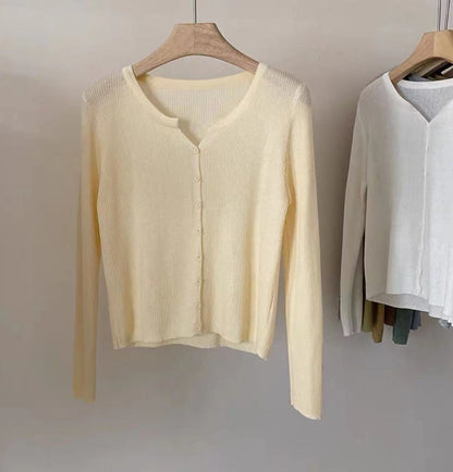 Women's figure-hugging cardigan with elegant button closure and fine ribbed texture NOVAE