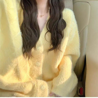 Women's oversized cardigan with soft fleece and special button details NOVAE