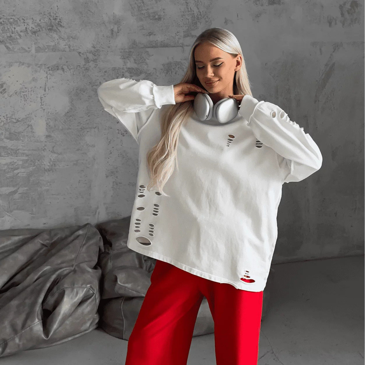 Women's casual oversized sweater with creative ripped details NOVAE