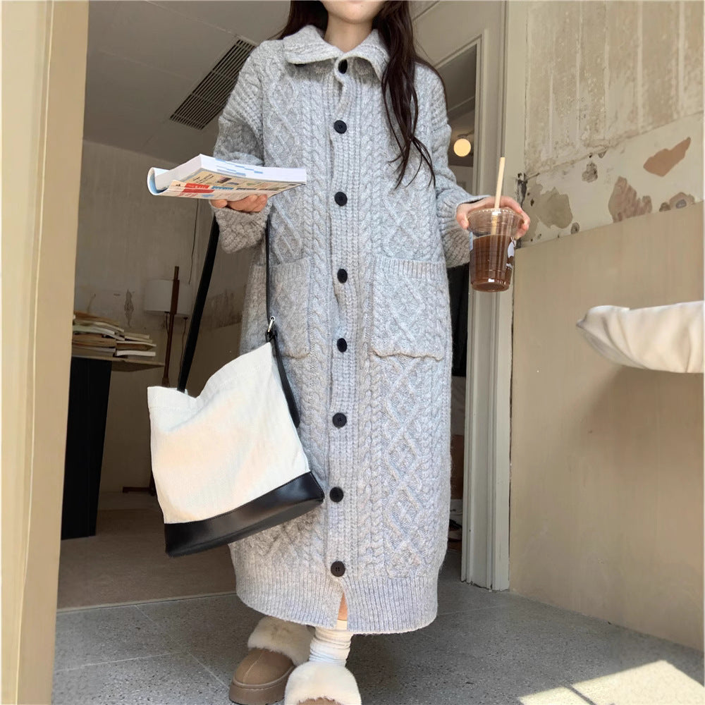 Women's chunky knit button-up coat with elegant cable pattern and practical pockets NOVAE