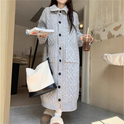 Women's chunky knit button-up coat with elegant cable pattern and practical pockets NOVAE
