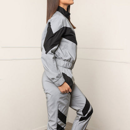 Women's sporty windbreaker set with modern color block design and elastic cuffs NOVAE