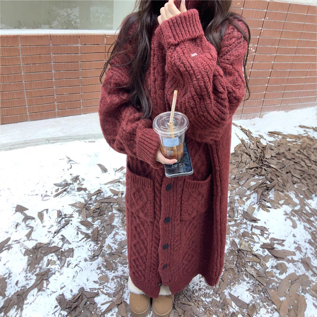 Women's chunky knit button-up coat with elegant cable pattern and practical pockets NOVAE