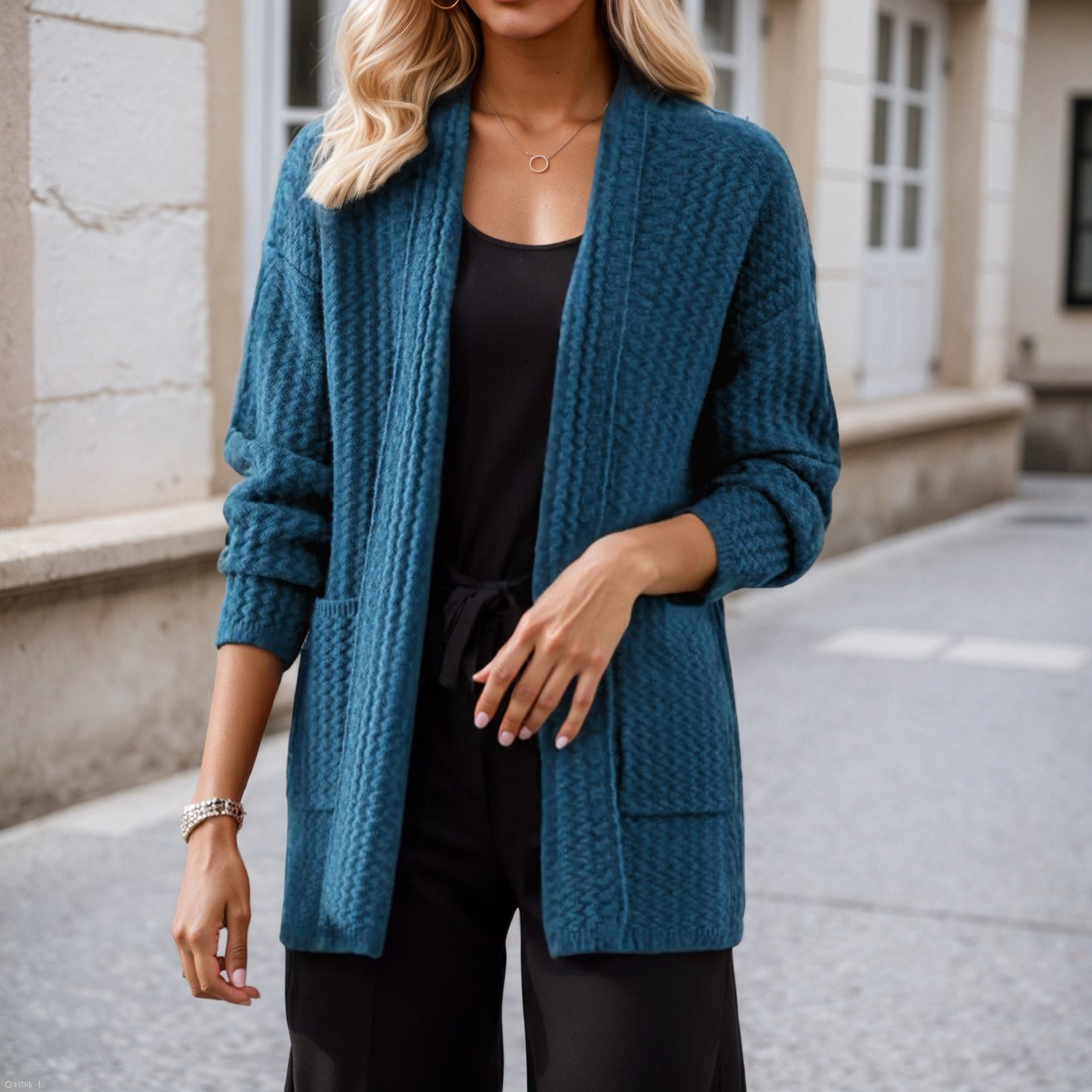 Women's cardigan with modern cable patterns and practical pockets NOVAE
