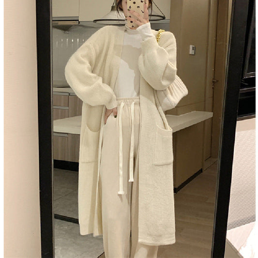 Women's long knit cardigan with practical pockets and elegant silhouette NOVAE