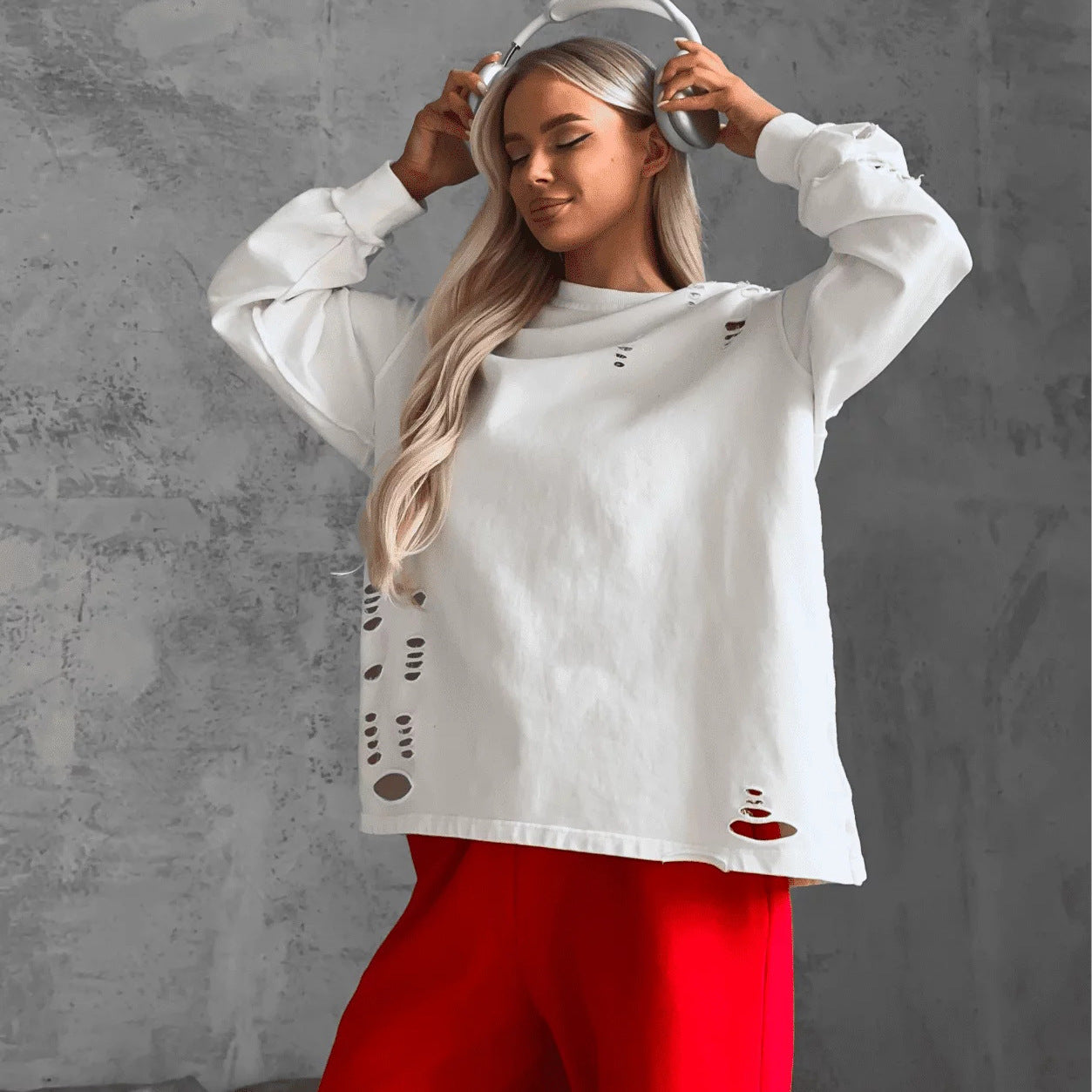 Women's casual oversized sweater with creative ripped details NOVAE