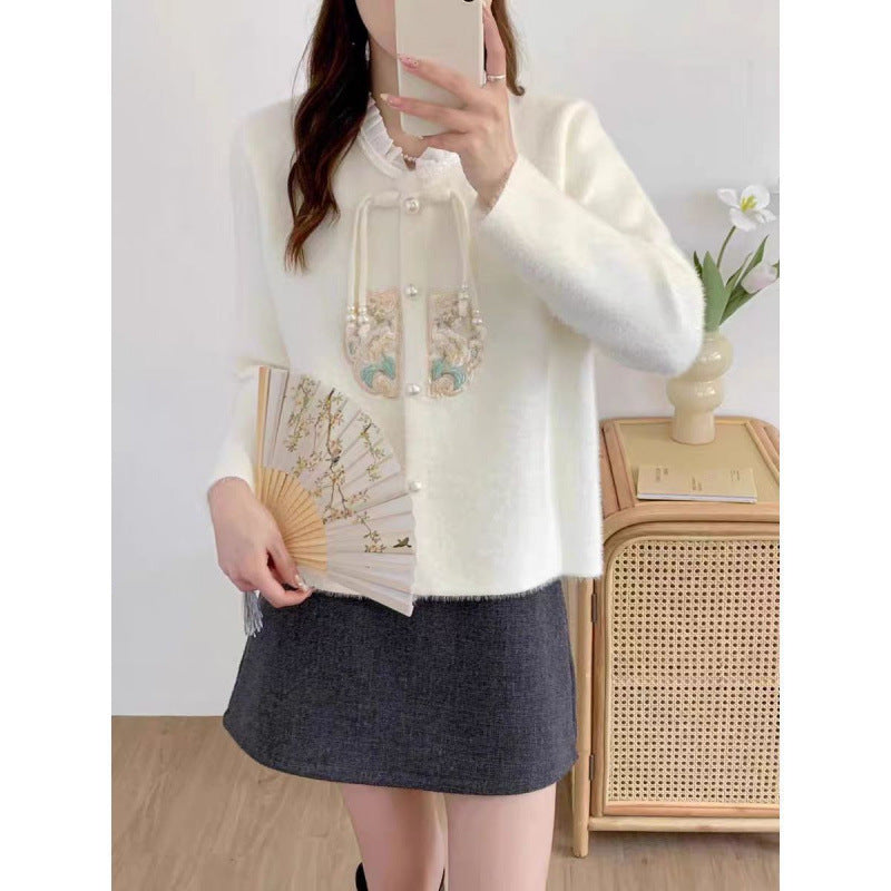 Women's luxury knit sweater with decorative button details and ruffles NOVAE