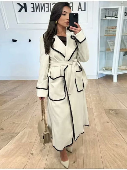 Women's elegant long coat with tie belt and contrasting piping NOVAE