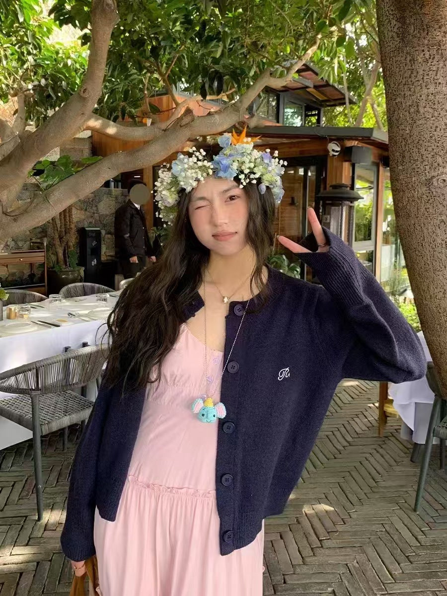 Women's cardigan with fine rib pattern and contrasting button details NOVAE