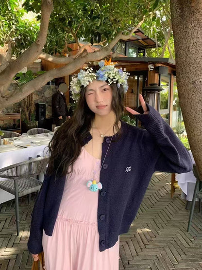 Women's cardigan with fine rib pattern and contrasting button details NOVAE