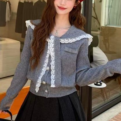 Women's cardigan with ruffled neckband and decorative buttons NOVAE