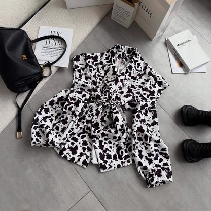 Women's classic blouse with decorative tie and fashionable spotted pattern NOVAE