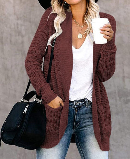 Women's knitted cardigan with practical pockets and airy structure NOVAE