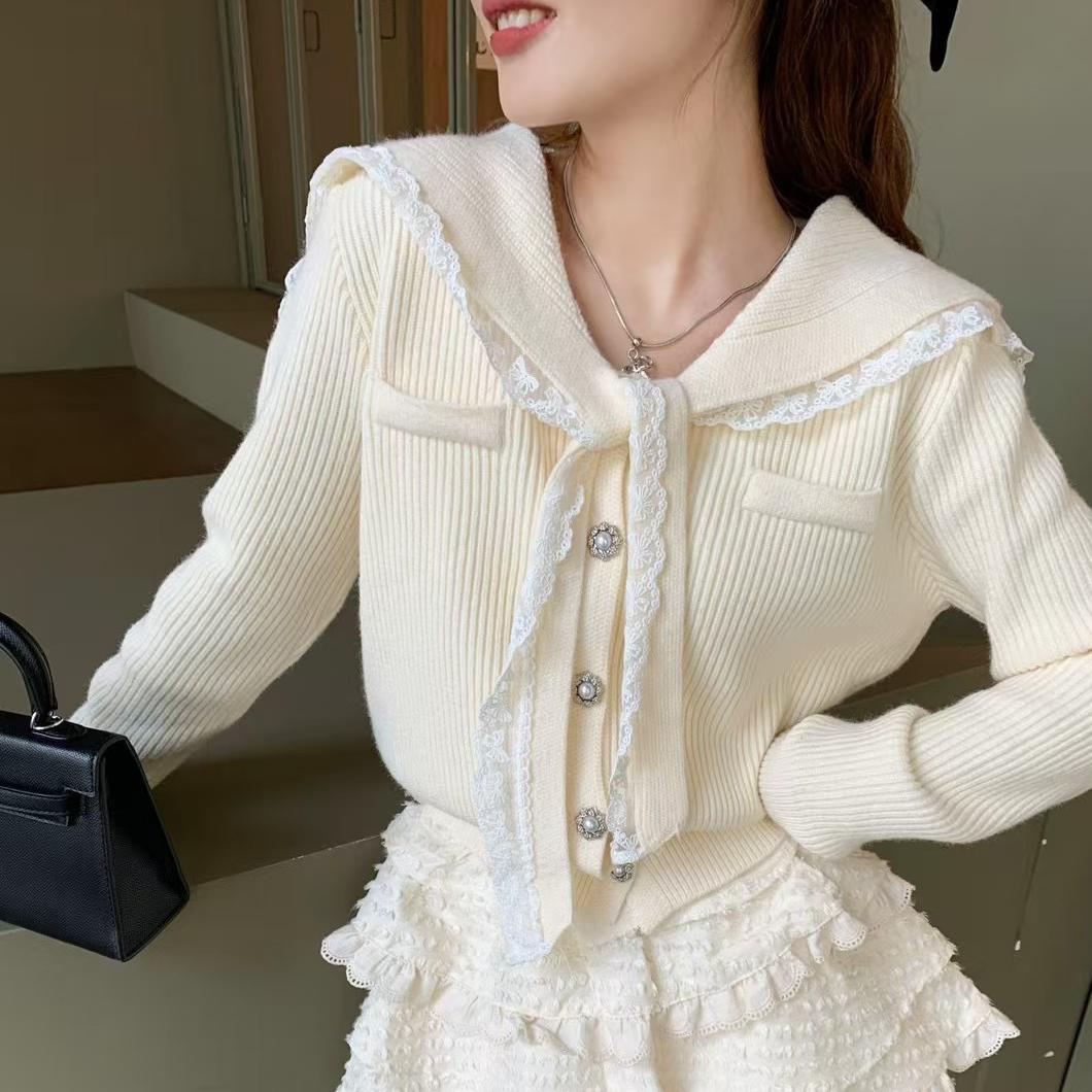 Women's cardigan with ruffled neckband and decorative buttons NOVAE