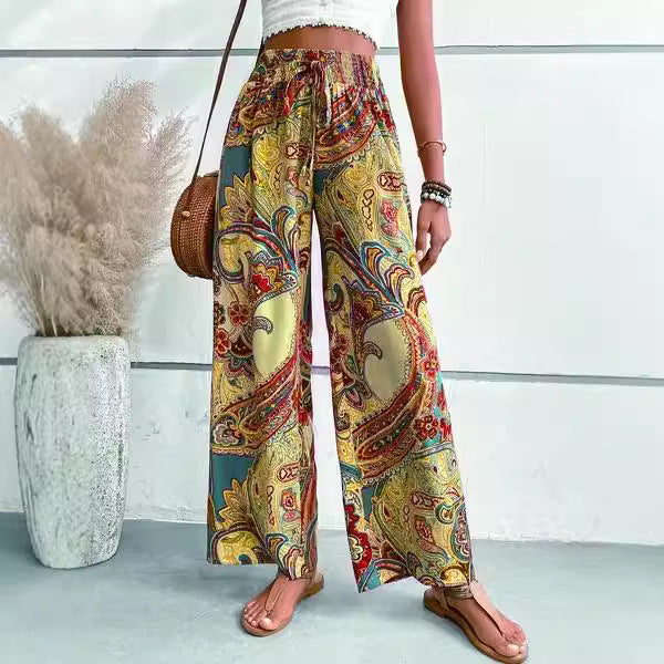 Women's wide-leg palazzo pants with colorful paisley pattern and elastic waistband NOVAE