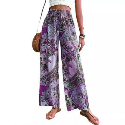 Women's wide-leg palazzo pants with colorful paisley pattern and elastic waistband NOVAE