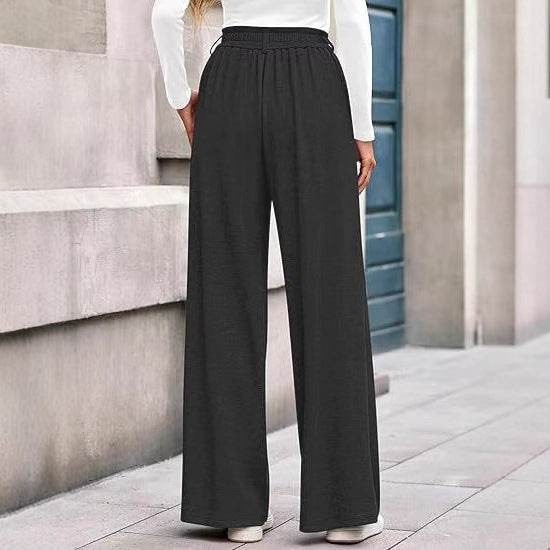 Women's wide-leg trousers with a high waistband and practical side pockets NOVAE
