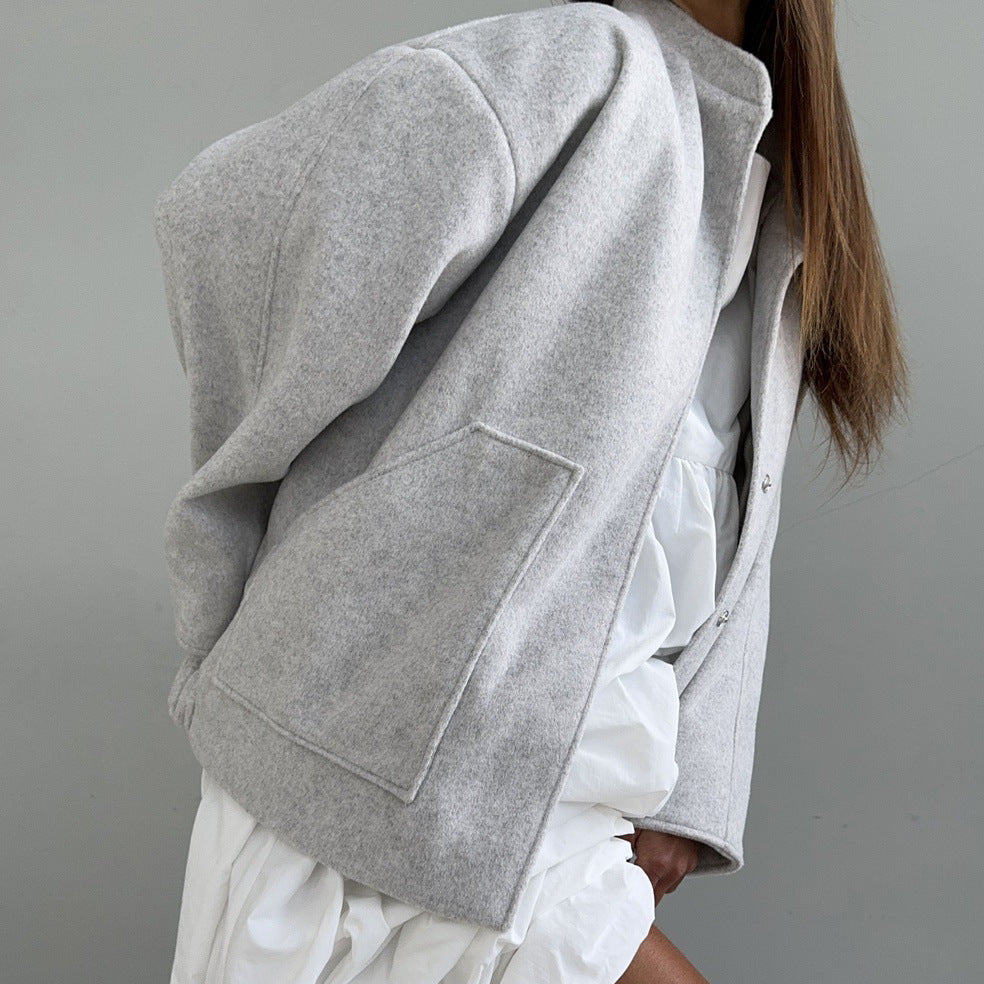 Women's oversized wool jacket with simple button details and practical pockets NOVAE