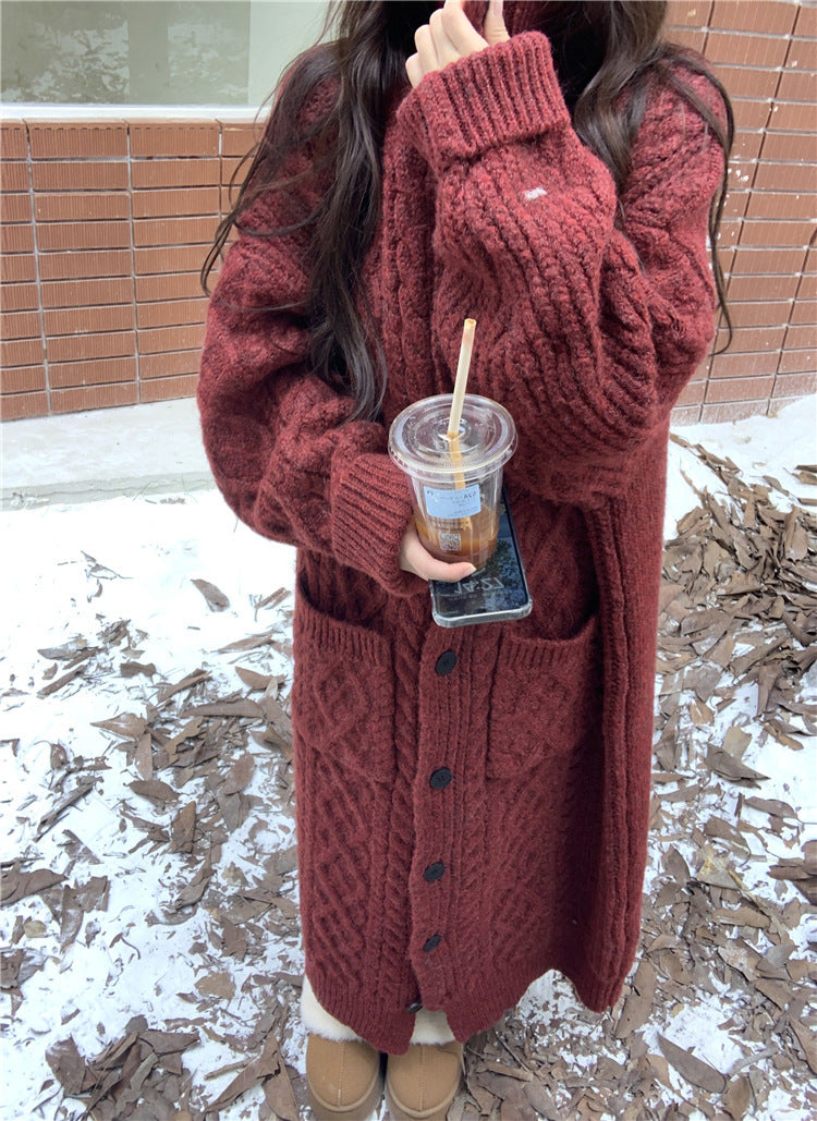 Women's chunky knit button-up coat with elegant cable pattern and practical pockets NOVAE