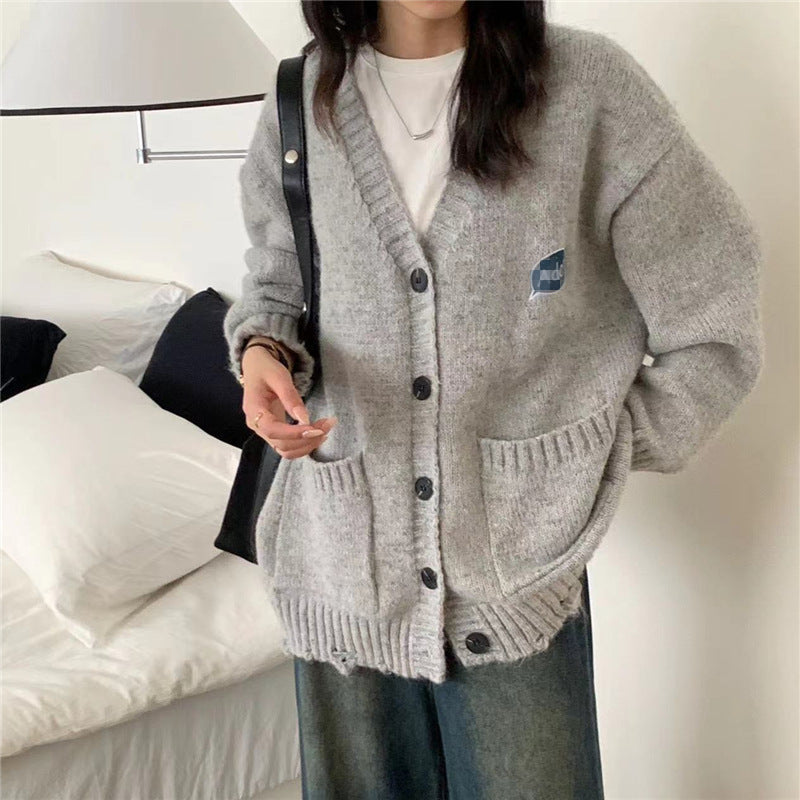 Women's chunky knit cardigan with practical pockets and button details NOVAE